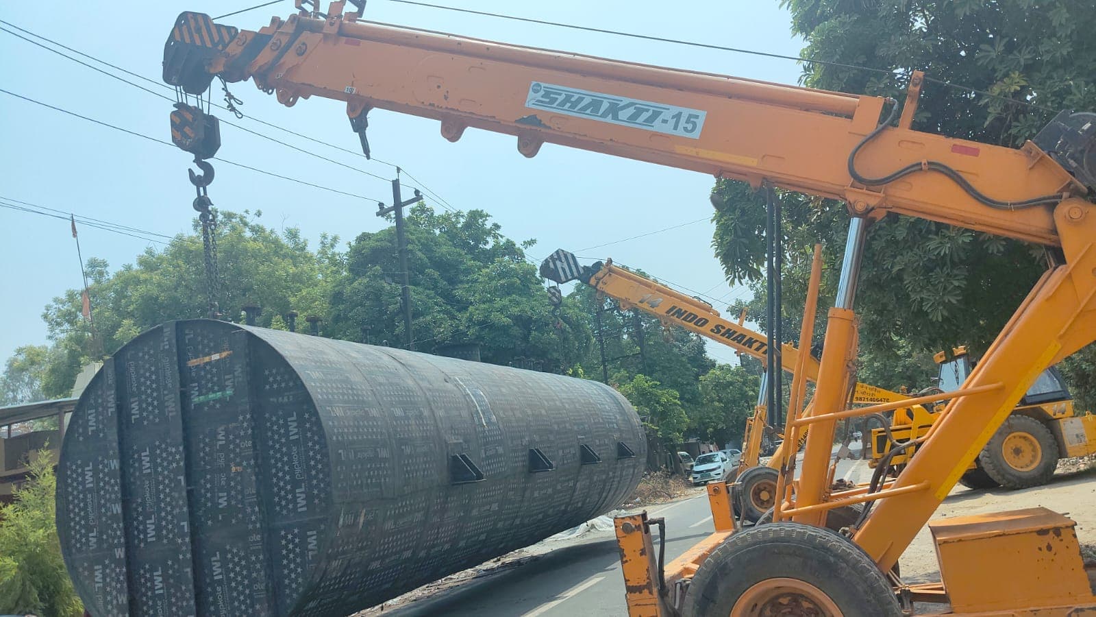 On-site tank installation with crane